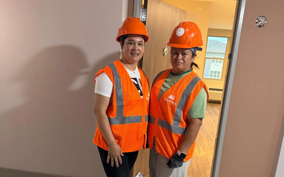 Solutions Cleaning team in hard hats and branded safety vests on a post-construction job in Bedford Heights
